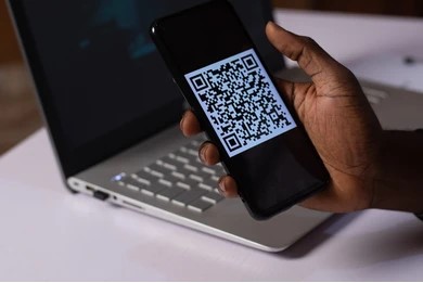 black man holding smartphone qr 260nw 2102499088